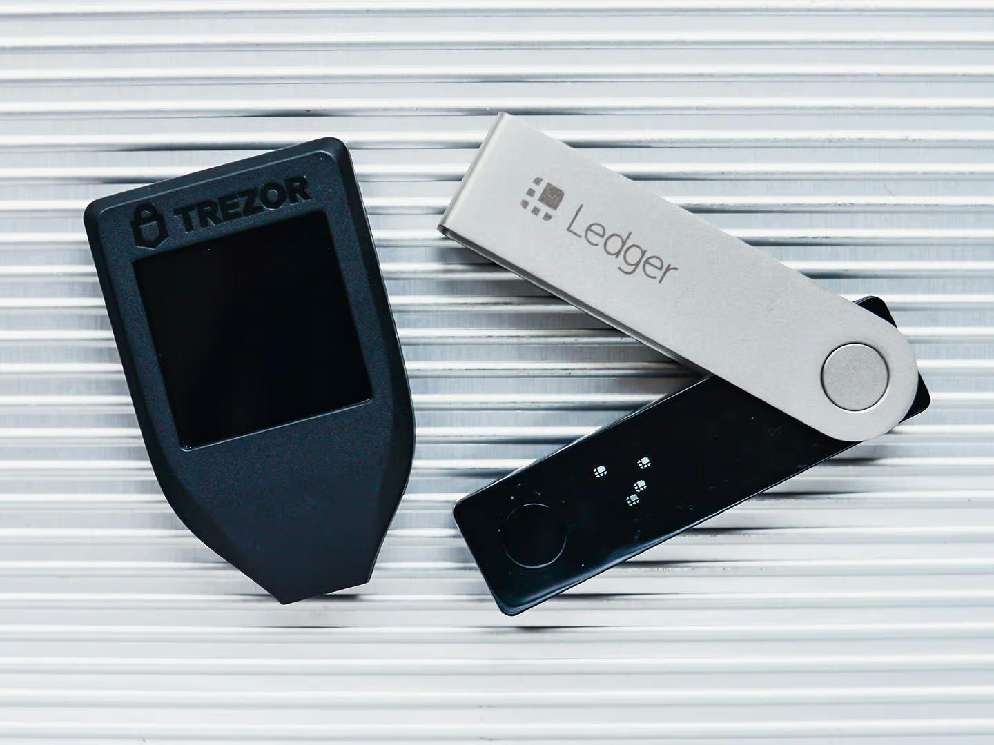 Sleek side-by-side comparison of OKX Wallet app interface, Trust Wallet mobile screen, and Ledger Nano X hardware device for 2026 crypto self-custody wallet review