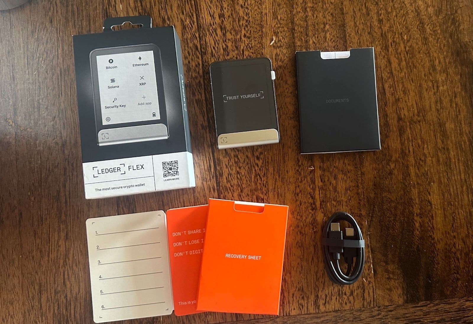 Side-by-side comparison of OKX Wallet mobile app interface with multi-chain support and Ledger Nano X hardware wallet featuring secure chip for crypto self-custody security 2026